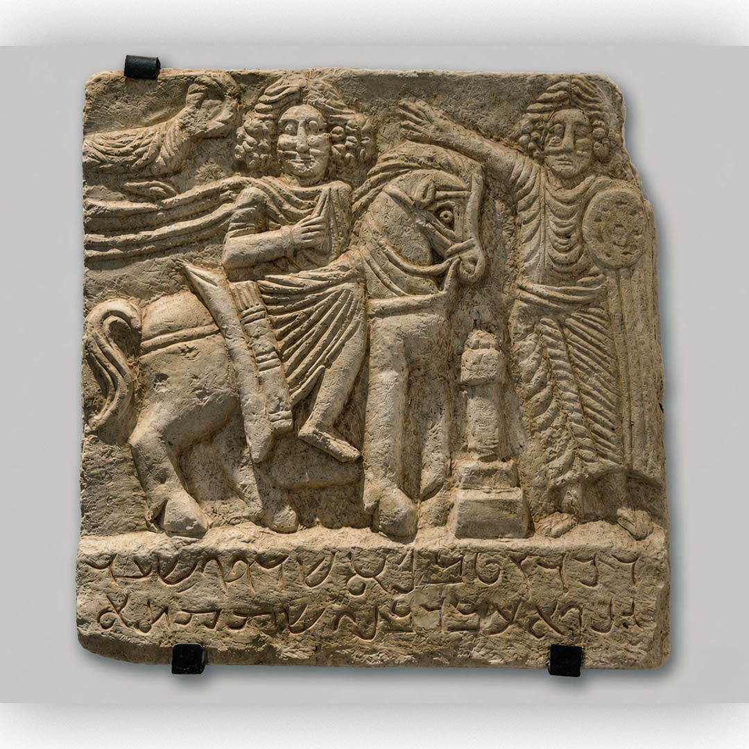 bas-relief, dated to the 2nd century CE, discovered at Dura-Europos near the southern wall, It depicts two male figures standing on either side of an altar