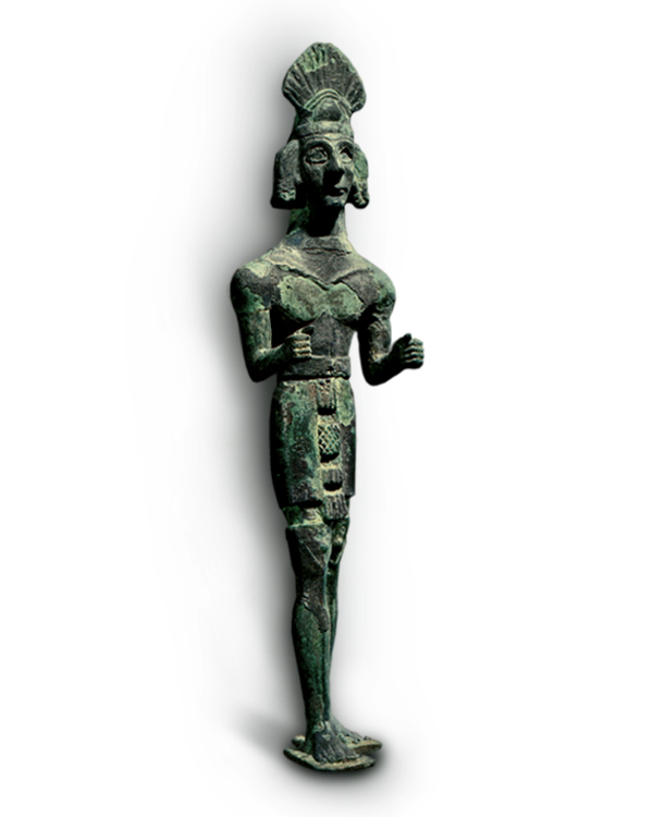 Bronze statuette of a standing male figure with traces of silver plating, attributed to the north of Syria. and preserved in the National Museum of Damascus.