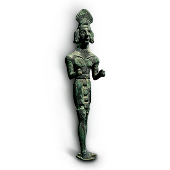 Bronze statuette of a standing male figure with traces of silver plating, attributed to the north of Syria. and preserved in the National Museum of Damascus.
